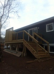 Custom patio with black square spindles.